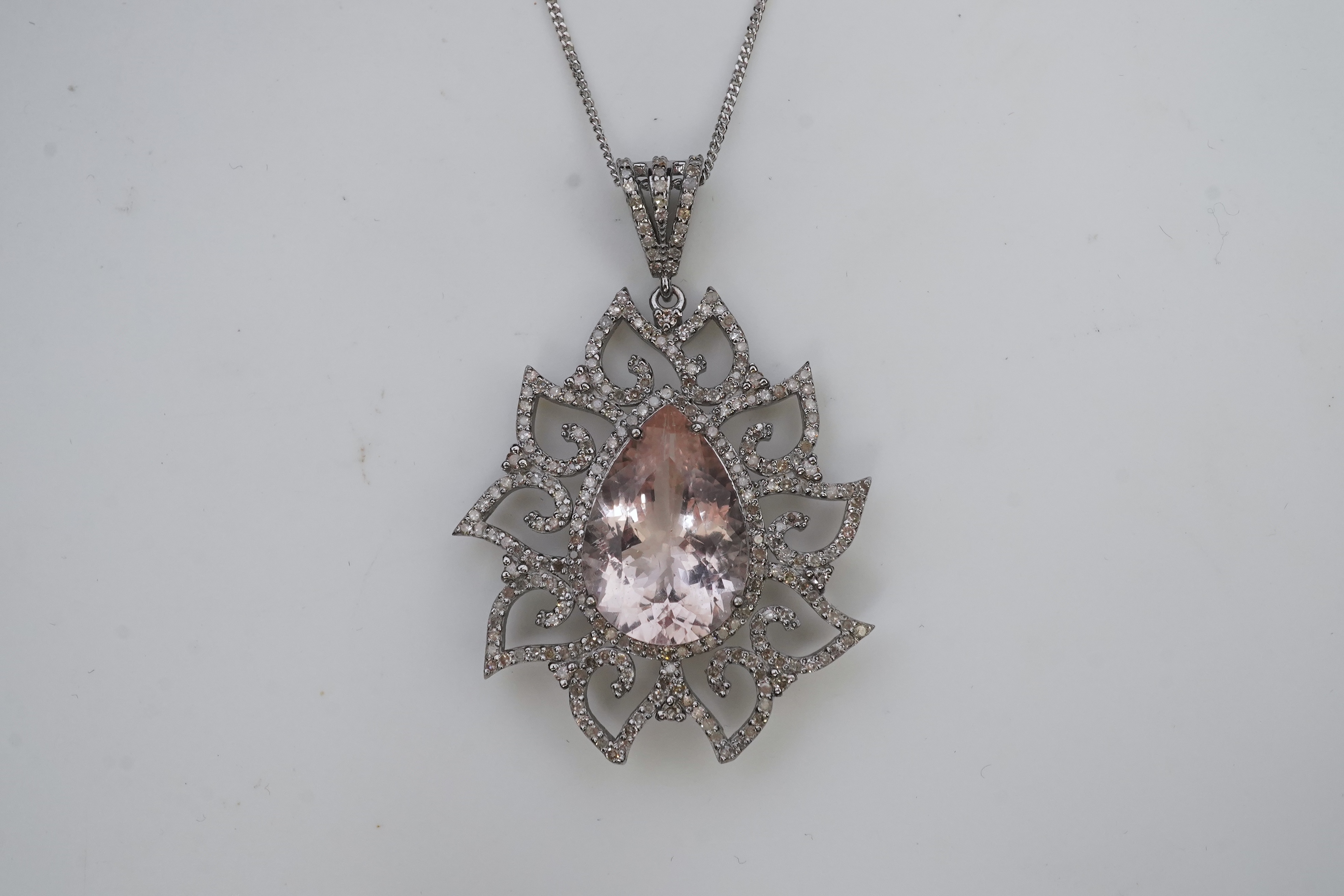 A morganite and diamond pendant